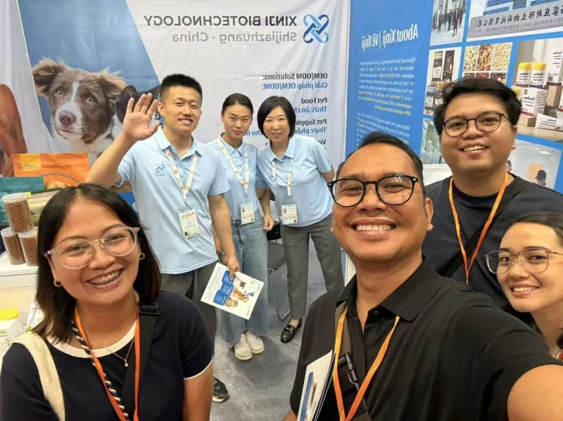 Xinji Pet Food team meeting buyers at Petfair Vietnam 2026 Booth P186