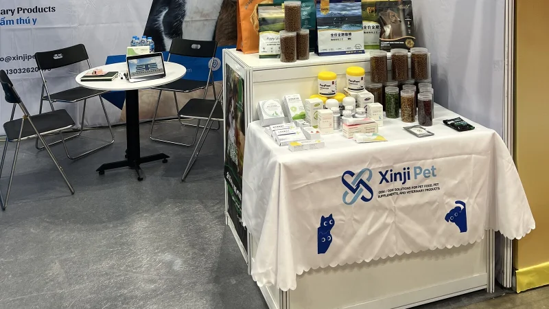 Pet food and supplement products displayed at a pet industry trade fair booth